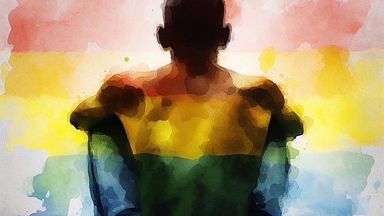 Illustration av en man som sitter på marken med regnbågsfärger. Foto: Mostphotos