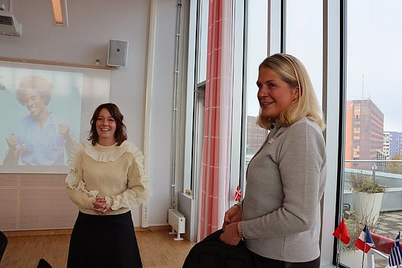 Bild av minister och rektor.